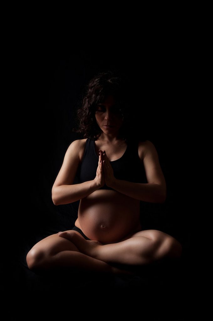 Meditation pose during pregnancy photoshoot